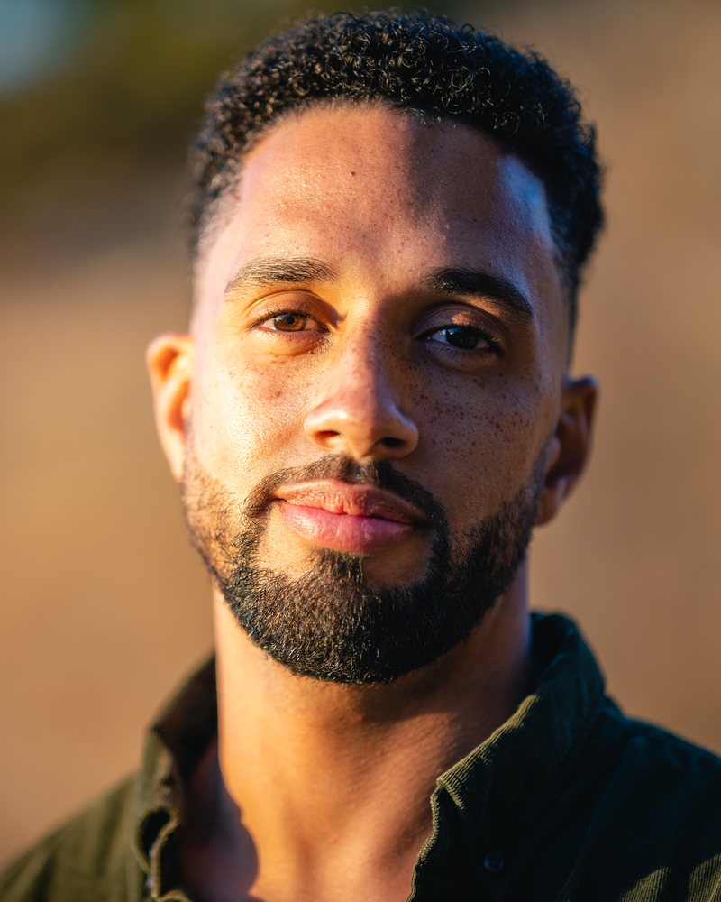 Close portrait of Nolan T. Krueger in warm evening light.